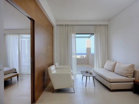 One Bedroom Suite Sea View | Living area | 39-inch flat-screen TV with satellite channels, TV, table tennis