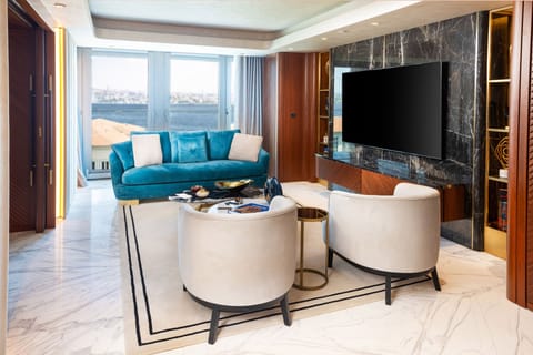 The Maestro Penthouse | Living area | Flat-screen TV, video-game console, MP3 dock, smart speakers