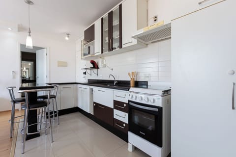 Apartment | Private kitchen | Full-size fridge, microwave, cookware/dishes/utensils