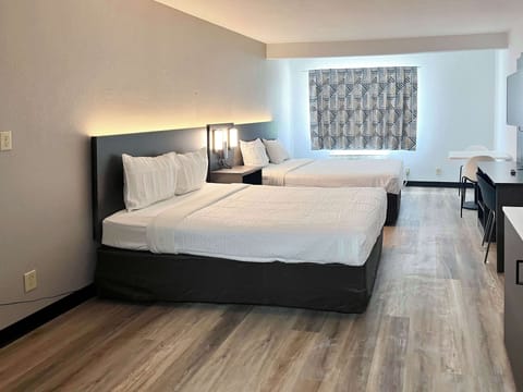 Desk, laptop workspace, blackout drapes, iron/ironing board