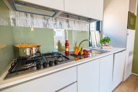 Full-size fridge, highchair, dining tables