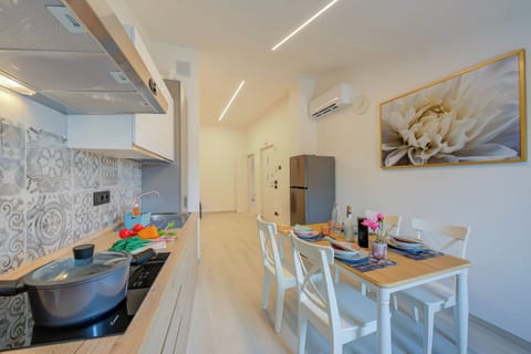 Standard Apartment, Multiple Bedrooms (Magnolia Apt - Palazzo Palermo 1817) | Private kitchen | Fridge, microwave, stovetop, dishwasher