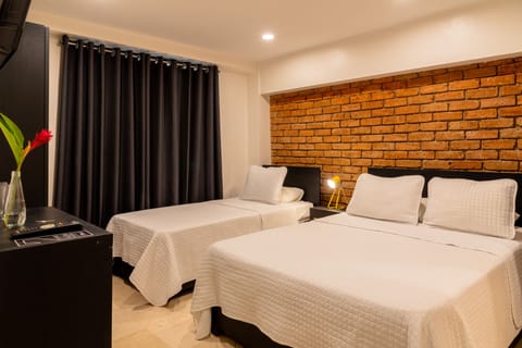 Executive Triple Room | Minibar, in-room safe, iron/ironing board, free WiFi