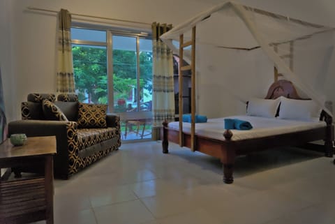 Family Room, Garden View, Beachfront | In-room safe, individually decorated, individually furnished