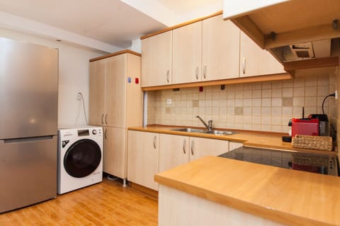 Apartment | Private kitchen | Full-size fridge, oven, toaster, cookware/dishes/utensils