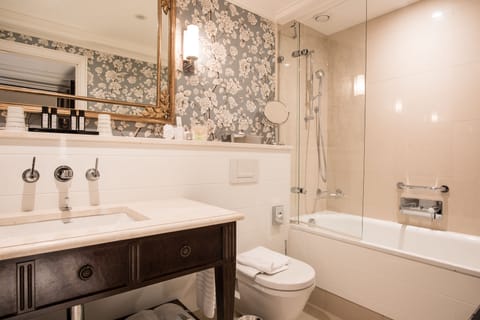 Designer toiletries, hair dryer, bathrobes, slippers