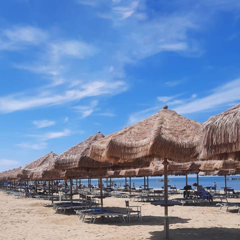 Beach nearby, white sand, sun loungers, beach umbrellas