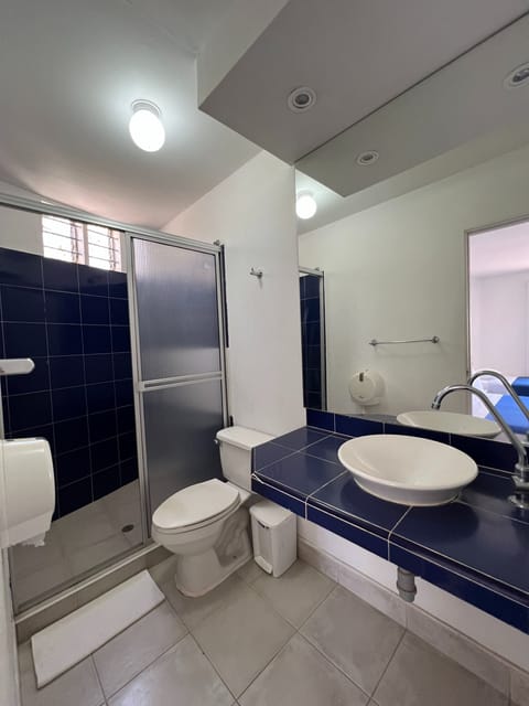 Superior Quadruple Room | Bathroom | Shower, towels, soap, toilet paper