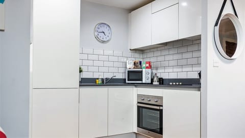 Apartment, 1 King Bed | Private kitchen | Oven, dishwasher, electric kettle, toaster