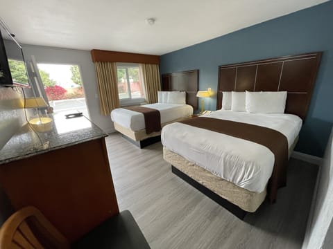 Economy Room, 2 Double Beds, Non Smoking | Desk, iron/ironing board, free WiFi, bed sheets