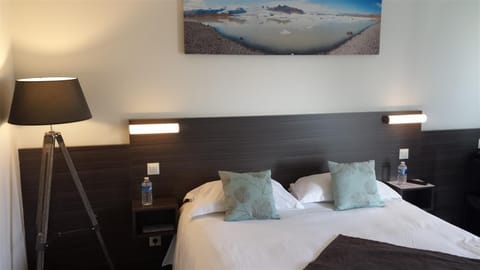 Premium bedding, desk, laptop workspace, blackout drapes