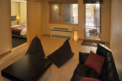 Japanese and Western with Private Open Air Onsen, Non Smoking | Living area | Flat-screen TV, table tennis