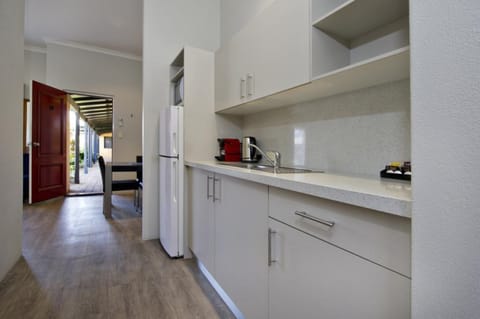 Deluxe 1 Bedroom Apartment (Unit 10) | Private kitchen | Fridge, microwave, espresso maker, coffee/tea maker