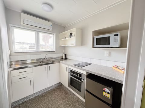 Downstairs King Studio | Private kitchen | Fridge, microwave, electric kettle, toaster