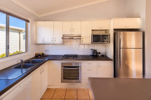 Villa (3BR) - 1B | Private kitchen | Microwave, stovetop, coffee/tea maker, cookware/dishes/utensils