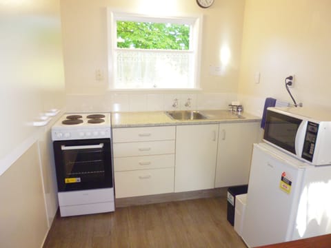 Two Bedroom Apartment, Upstairs | Private kitchen | Mini-fridge, microwave, toaster, cookware/dishes/utensils