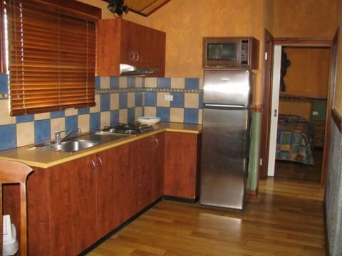 Luxury Suite, 2 Bedrooms | Private kitchen | Fridge, stovetop, coffee/tea maker, electric kettle