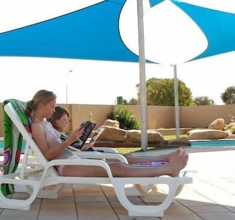 Outdoor pool, open 8:00 AM to 7:00 PM, sun loungers