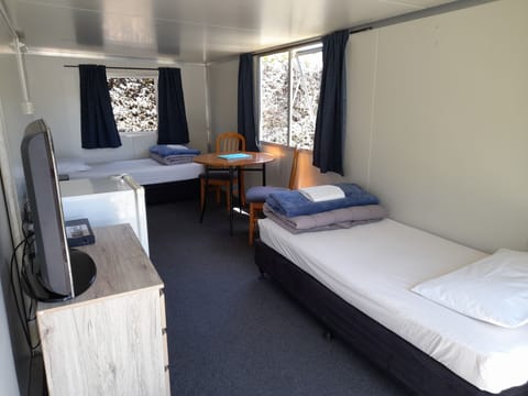 Basic Cabin, 2 Twin Beds, Shared Bathroom | WiFi, bed sheets