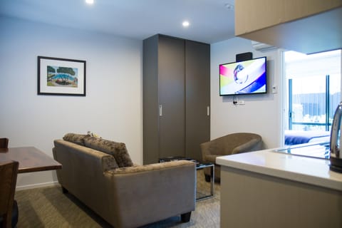 Junior Apartment, 1 Queen Bed | Living room | 42-inch LED TV with satellite channels, TV