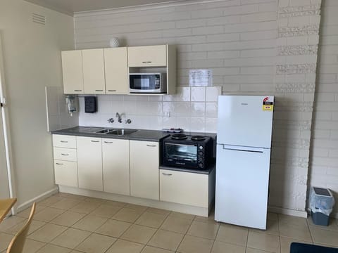 Family Apartment, 1 Bedroom | Private kitchen | Fridge, microwave, coffee/tea maker, electric kettle