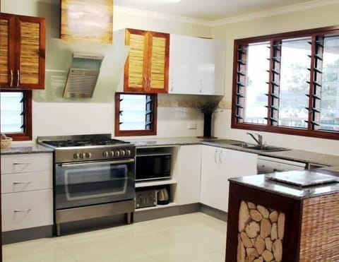 Beachfront 4 Bedroom Penthouse Apartment | Private kitchen | Fridge, microwave, coffee/tea maker, electric kettle