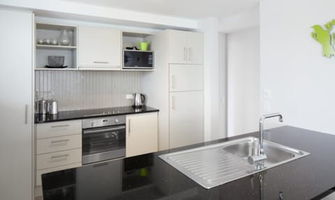 Two Bedroom Penthouse | Private kitchen | Fridge, microwave, electric kettle