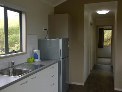 Two Bedroom Deluxe | Private kitchenette | Fridge, microwave, electric kettle, toaster