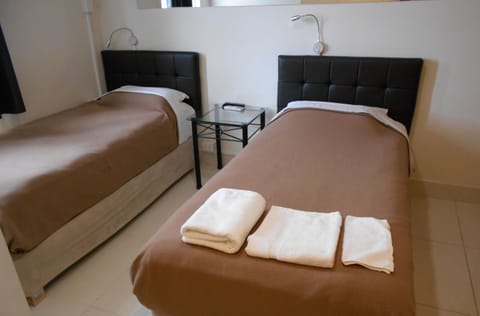 Compact Twin Room | Iron/ironing board, free WiFi, bed sheets