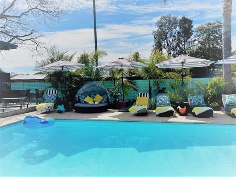 Seasonal outdoor pool, open 8:00 AM to 9:00 PM, pool umbrellas