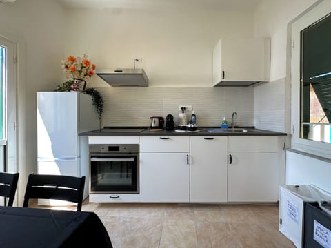 Exclusive Apartment | Private kitchen | Full-size fridge, microwave, oven, stovetop