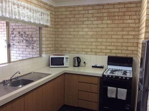 Superior Villa, 2 Bedrooms | Private kitchen | Microwave, electric kettle, cleaning supplies, freezer