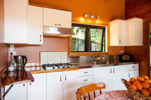 Standard Suite, 1 Bedroom, Non Smoking, Kitchen (HoneyMoon Cottage) | Private kitchen | Highchair, cookware/dishes/utensils