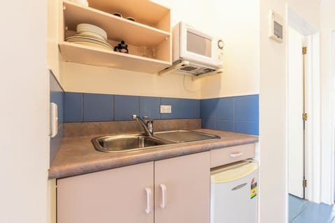 One Bedroom Access with Shower | Private kitchen | Mini-fridge, microwave, electric kettle, toaster