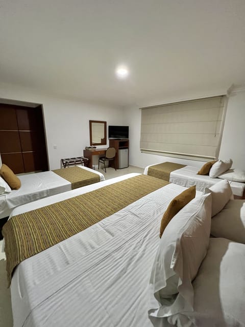 Family Triple Room | Minibar, in-room safe, desk, soundproofing