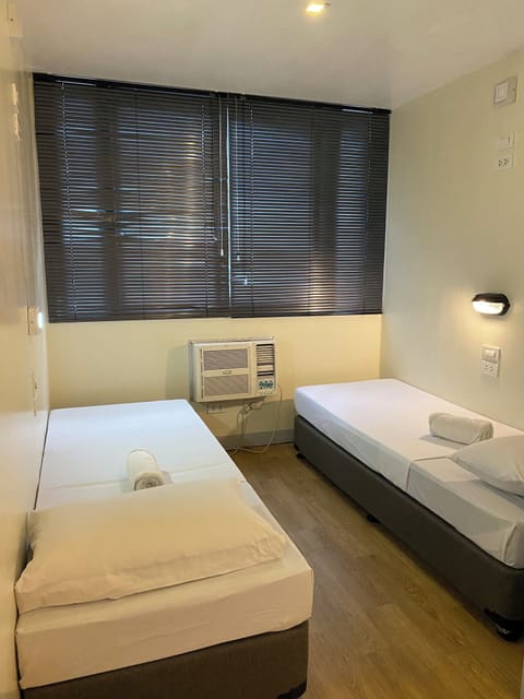 Standard Twin Beds Shared Bath | Desk, laptop workspace, free WiFi, bed sheets