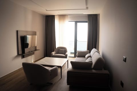 Deluxe Suite, Sea View | In-room safe, desk, blackout drapes, iron/ironing board