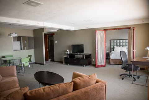 Suite, 1 Queen Bed, Non Smoking (One-Bedroom Suite) | Living area | 32-inch flat-screen TV with satellite channels, TV