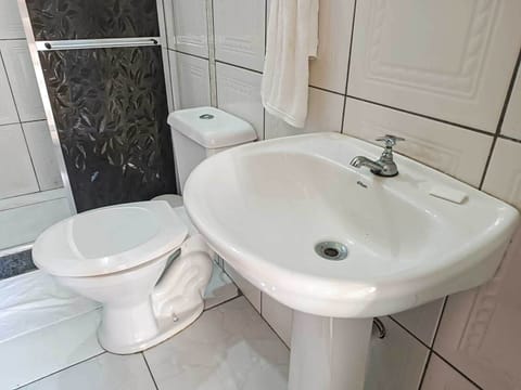 Family Room, Multiple Beds | Bathroom | Shower, towels, soap, toilet paper