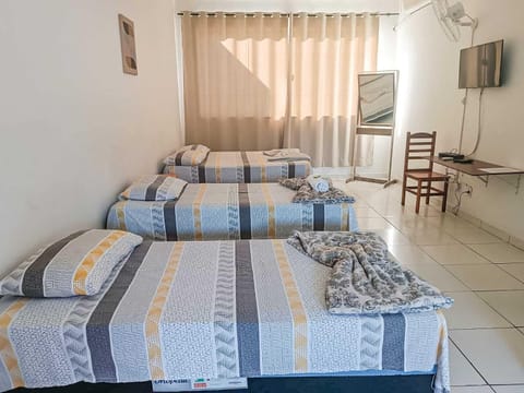 Standard Quadruple Room | Minibar, individually decorated, desk, laptop workspace