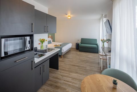 Premium bedding, desk, laptop workspace, blackout drapes