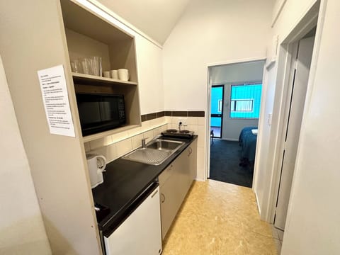 Luxury Apartment | Private kitchen | Fridge, microwave, electric kettle, toaster