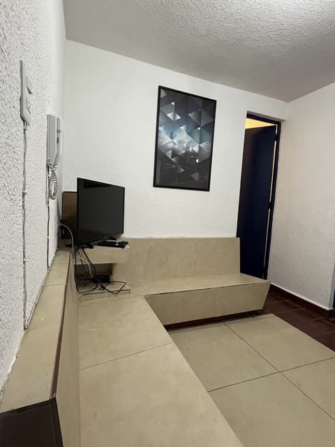 Economy Apartment | Living area | 70-cm Smart TV with cable channels