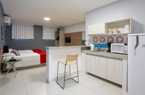 Executive Apartment, 1 Bedroom | Minibar, in-room safe, desk, iron/ironing board