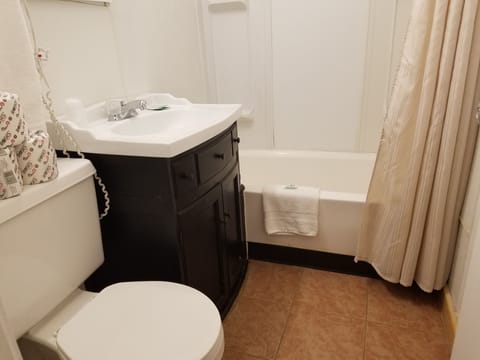 Standard Room, 2 Queen Beds | Bathroom | Combined shower/tub, hair dryer, towels