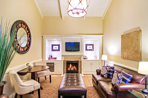 Premium Suite, 1 King Bed, Jetted Tub | Living area | 42-inch flat-screen TV with cable channels, TV, fireplace