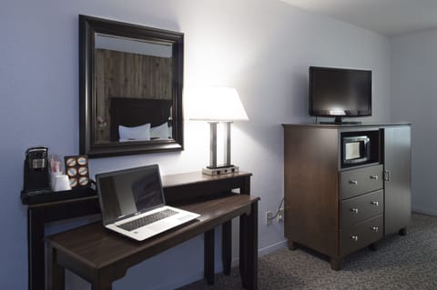 Desk, laptop workspace, iron/ironing board, cribs/infant beds