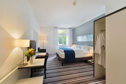 Premium bedding, free minibar items, in-room safe, desk