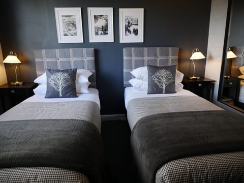 Two Bedroom Suite (1 Double and 1 King or 1 Double and 2 Single) | Blackout drapes, iron/ironing board, free WiFi, bed sheets