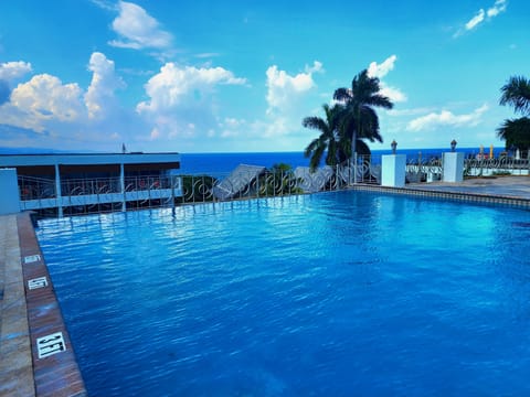 Outdoor pool, pool umbrellas, sun loungers